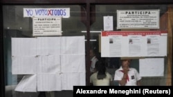 Foto Archivo. Perfiles de Candidatos a la Asamblea del Poder Popular. El Consejo Electoral Nacional (CEN) en Cuba incurrió en "graves deficiencias en cuanto a la transparencia, la independencia y la legitimidad de los procesos electorales". (CEN) (REUTERS/Alexandre Meneghini)